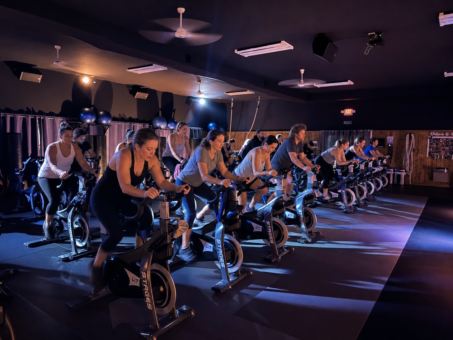 An energetic indoor cycling class at Seung-ni Fit Club Midland